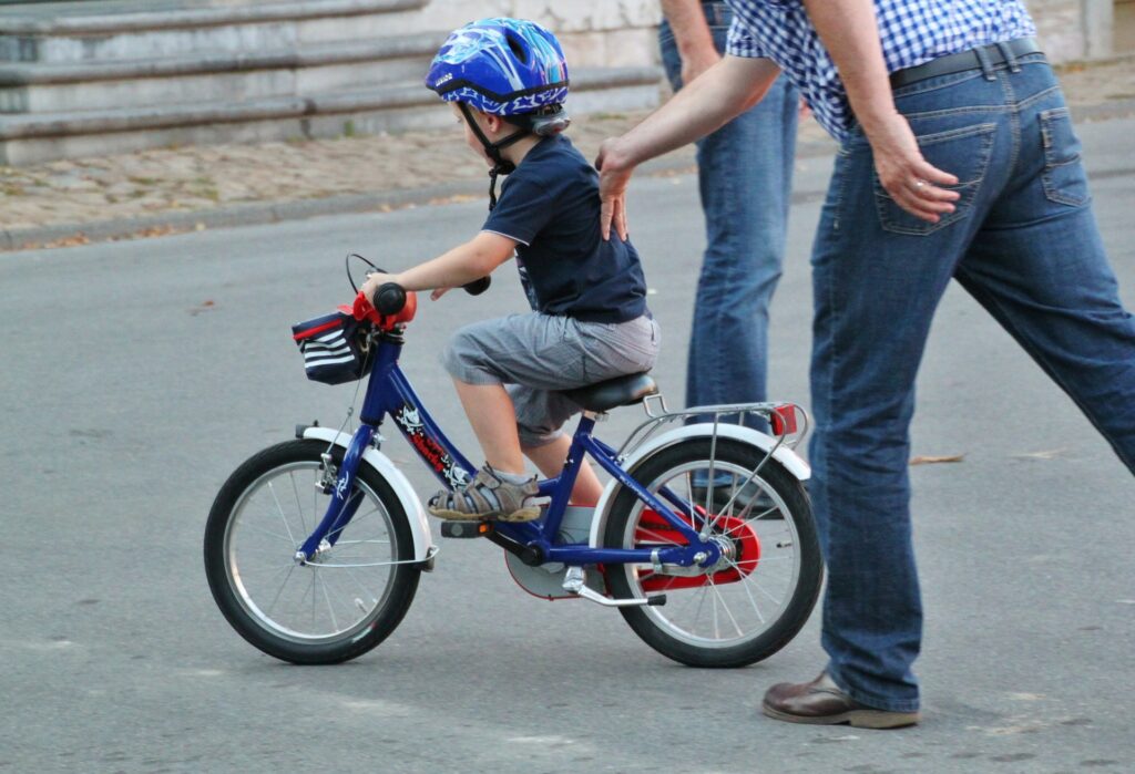 pedaling while learning how to ride a bike