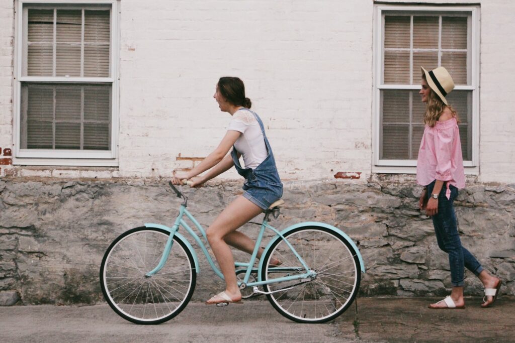 get friend to help you while riding a bike